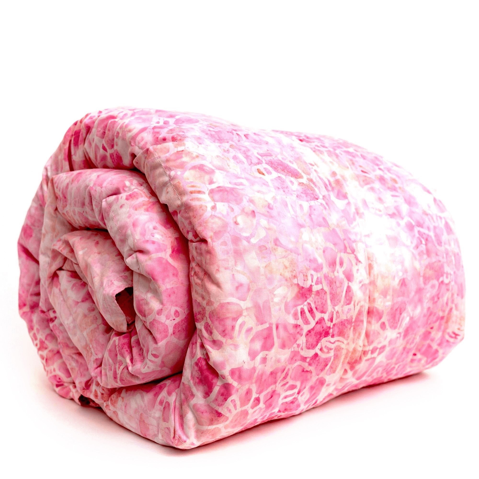 Woman under Mosaic Weighted Blankets Think Pink Batik Weighted Blanket in bed